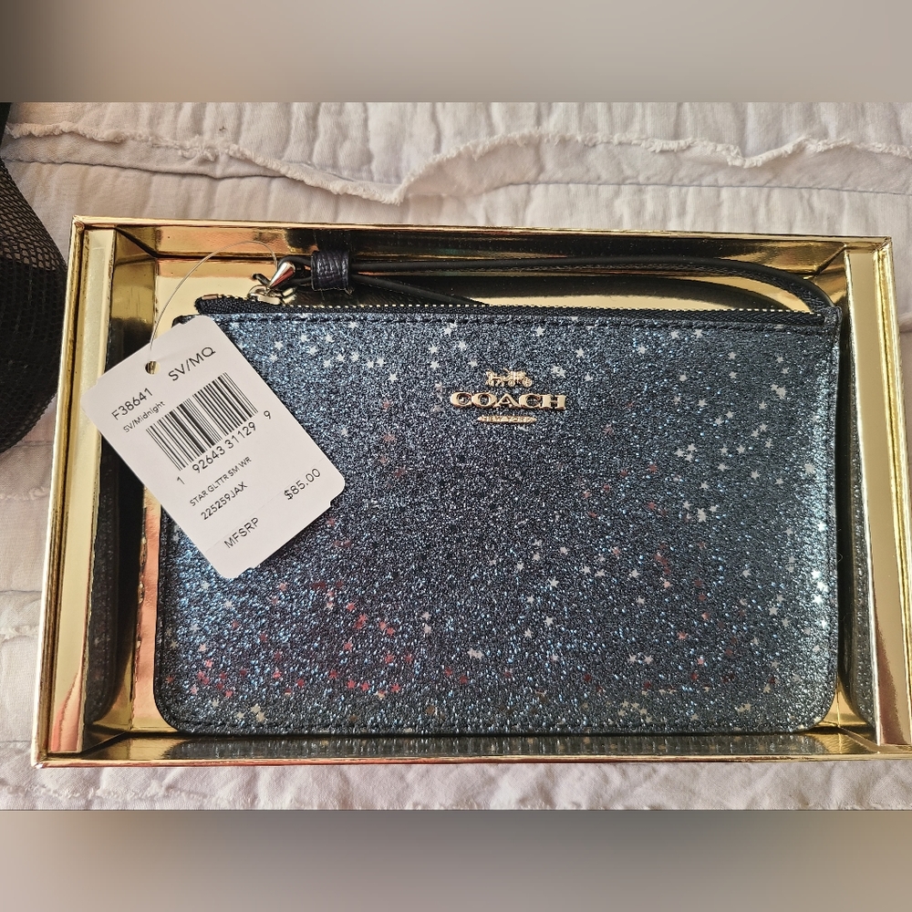 Coach Wristlet. Navy with glitter and stars. Brand new in box with tags.